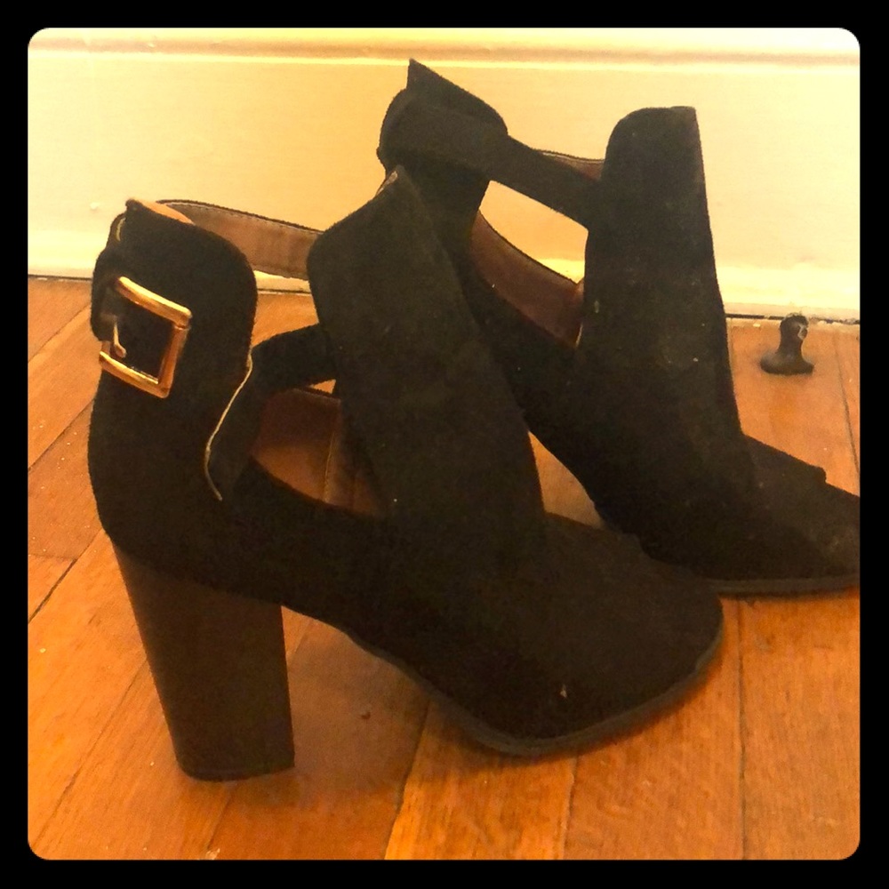 Black booties with gold buckle